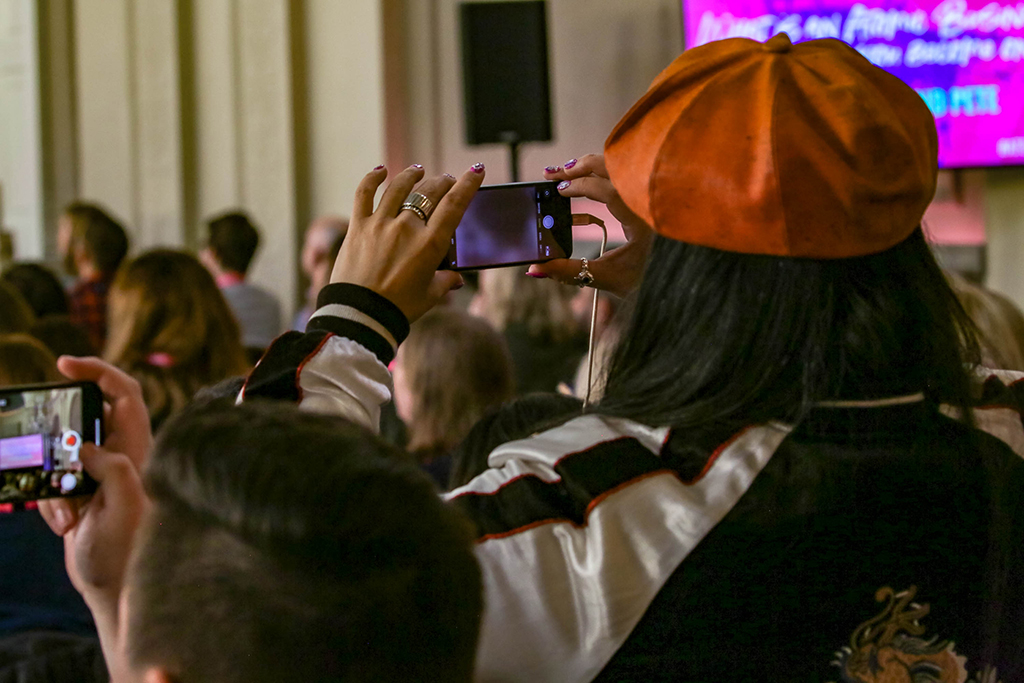 Creating FOMO or 'Fear Of Missing Out' Expert MayKing Tsang at Work at a Conference Photography for your Personal Brand