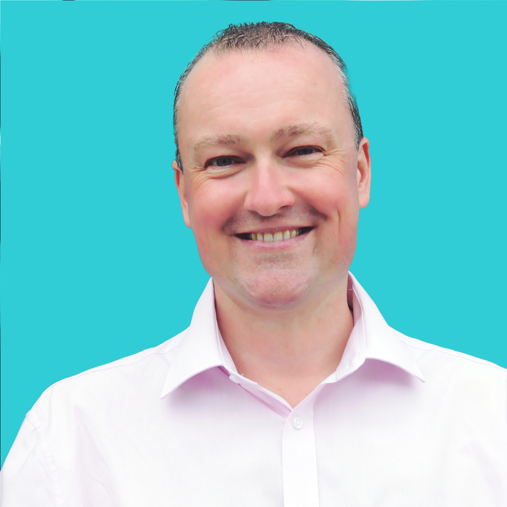 A professional headshot of Richard Tubb, an MSP expert, smiling in a white shirt against a bright turquoise background.